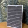 Blank striped card in a clear sleeve on a wooden table