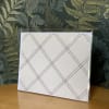 Blank plaid greeting card in a clear plastic sleeve