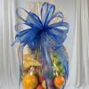Fruit basket wrapped in clear cellophane with a large blue bow