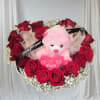Red rose bouquet with a pink teddy bear and heart decoration