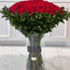 200 elegan red roses wrapped with greens and with vase