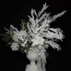 breathtaking winter arrangement designed to capture the magic of a quiet snowfall.