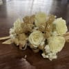White flowers with gold ribbon corsage