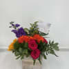 Mixed bouquet in a wooden box with pink roses and orange gerberas
