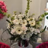 White and blush floral arrangement in a silver vase