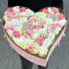 Heart-shaped box of pink and white roses and carnations