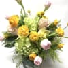 Bouquet of yellow and pink flowers with green hydrangea on a white background