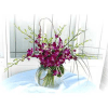 Purple orchid arrangement in a clear glass vase