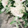 Blush roses with white filler flowers and greenery