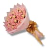 Pink rose bouquet with gold-wrapped chocolates and a gold ribbon