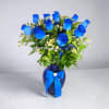 A beautiful arrangement featuring premium blue roses, delicate chamomile, pink ginger glass