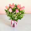 A beautiful arrangement featuring premium baby pink roses, delicate chamomile, pink ginger