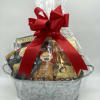 Gift basket of assorted snacks wrapped in clear cellophane with a red bow