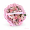 Pink bouquet of roses and mums wrapped in pastel paper with an anniversary ribbon