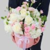 Pink and white bouquet in a round pink box with ribbon
