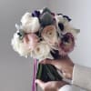 This bridal bouquet is made in a classic round shape from delicate