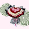 Heart-shaped bouquet of red, pink, and white roses with patterned wrapping
