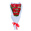 Tall bouquet of many red roses with small white filler flowers wrapped in white paper and tied with a red ribbon