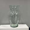 Clear glass vase on a white pedestal