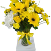 A beautiful yellow arrangement that includes many various flowers.