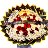 Round bouquet of red and cream roses with a crown topper and black ribbon