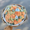 Bouquet combination of carnations, cotton, daisies and eucalyptus greenery.