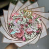 Pink rose bouquet with baby’s breath, butterflies, and gold crown picks