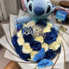 Blue Stitch plush with a bouquet of cream and blue roses