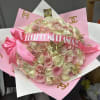 Pink and cream rose bouquet with a "Feliz Cumpleaños" ribbon