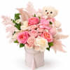 Pink and cream rose arrangement in a round box with a teddy bear