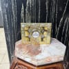 Box of Ferrero Rocher chocolates on a decorative stool