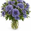 Purple chrysanthemum bouquet in a clear glass vase