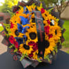 Bouquet of sunflowers and red roses with blue butterfly picks
