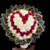 Heart-shaped bouquet of red and white roses in black wrap