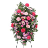 Standing spray of pink and lavender flowers on an easel