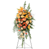 Orange and peach floral standing spray on a black easel