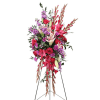 Tall standing floral spray with red and purple flowers on a metal easel