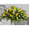 Large yellow and white floral arrangement with lilies and roses
