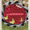 Heart-shaped bouquet of red roses with a pink ribbon and butterfly decorations