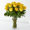 Yellow roses arranged in a clear glass vase