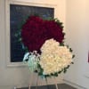 Express your deepest condolences with this elegant and heartfelt floral tribute. This