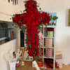 A powerful symbol of faith, love, and remembrance, this stunning red rose