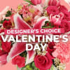 Pink and red mixed bouquet with lilies and roses, overlaid with Valentine's Day text