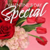 Red roses, pink hydrangeas, and red tulips on a pink background with Valentine's Day text