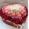 Round box of roses in red, pink, and white