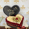 Heart-shaped rose box with red and white roses and gold chocolates