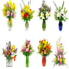 Assorted colorful flower bouquets in glass vases
