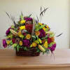 Mixed flower arrangement in a wicker basket