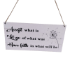 Hanging sign with a motivational quote and dandelion graphic