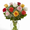 A dozen, 18, or 24 fresh roses arranged in a clear glass